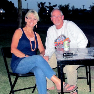 Mr. & Mrs. Padilly sitting at her Heirloom Glamping Table
