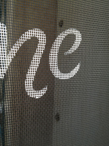 Close-up of stenciling screen door on Casita Travel Trailer